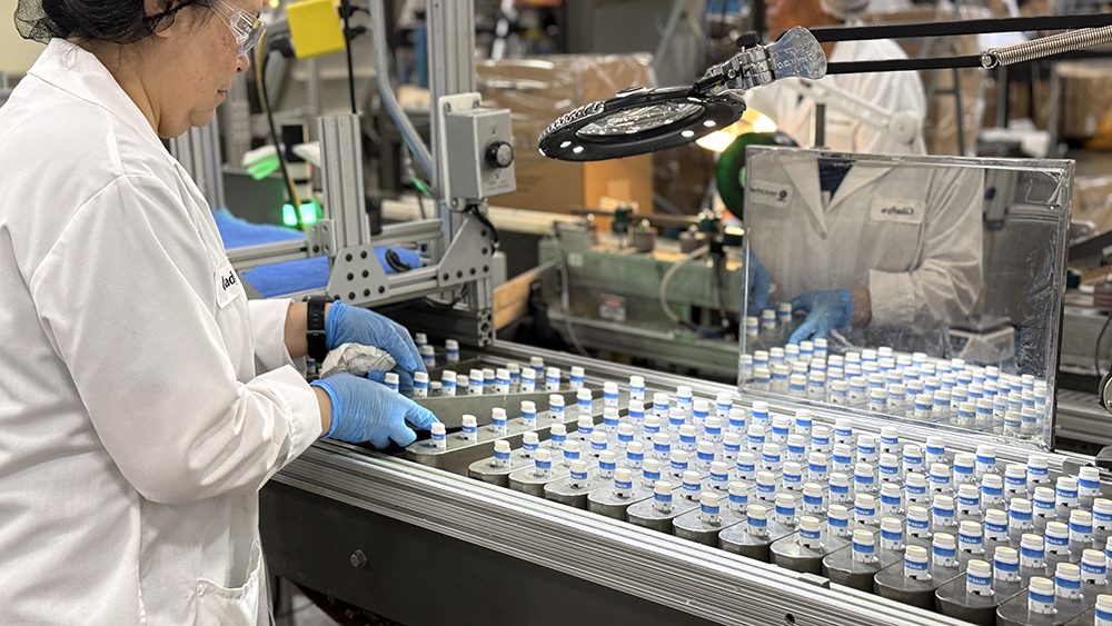 lip balm products on an assembly line